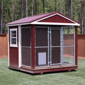 This 8x8 dog kennel is the perfect outdoor home for your furry friend. The kennel's red siding and white trim add a pop of color to your backyard and make it a standout feature. The kennel's durable wooden construction ensures it will withstand various weather conditions and remain a reliable and secure option for your pet. The kennel is equipped with proper ventilation to provide your pet with optimal air circulation, ensuring their comfort at all times. With ample space, this kennel is perfect for pets of various sizes, providing them with enough room to play, rest and move around. Whether used for personal or commercial purposes, this kennel is a practical and stylish solution for your pet's outdoor living needs. It will provide a safe and comfortable space for your furry friend while adding value to your backyard.